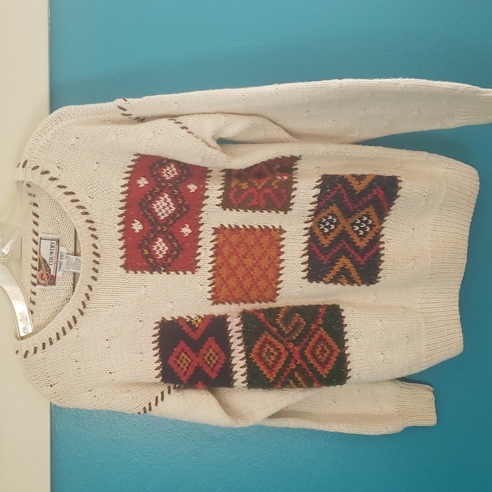 Vintage Hand knit  sweater with suede elbow patches and stitching.